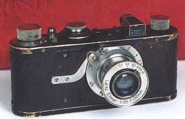Photograph of a well-worn Leica I with brown calfskin body covering.